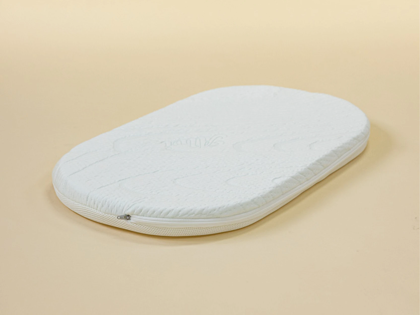 Baby mattress with a breathable cover in the cot